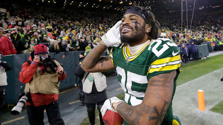 Green Bay Packers cornerback Keisean Nixon (25) is all smiles as he celebrates defeating the Kansas