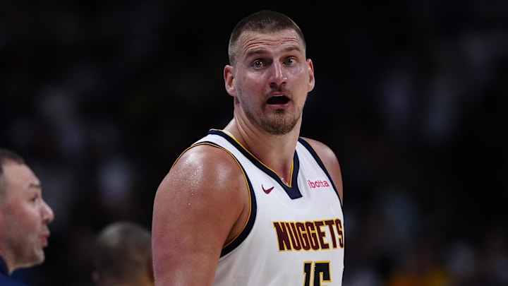 Apr 11, 2025; Denver, Colorado, USA; Denver Nuggets center Nikola Jokic (15) reacts in the fourth quarter against the Memphis Grizzlies at Ball Arena. Mandatory Credit: Ron Chenoy-Imagn Images