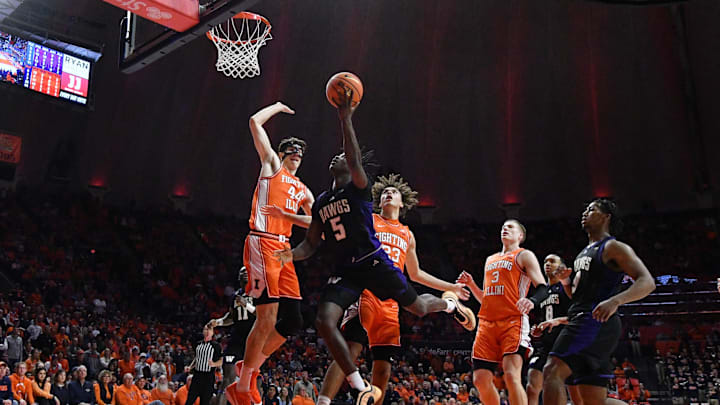 Jan 29, 2026; Champaign, Illinois, USA;  Illinois Fighting Illini forward Zvonimir Ivisic (44) blocks the way of Washington Huskies guard Zoom Diallo (5) and he drives to the basket during the second half at State Farm Center. Mandatory Credit: Ron Johnson-Imagn Images