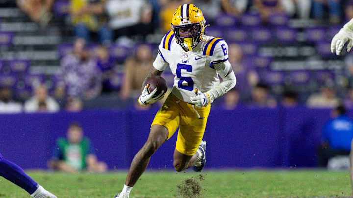 Nov 22, 2025; Baton Rouge, Louisiana, USA;  LSU Tigers wide receiver Barion Brown (6) runs against the Western Kentucky Hilltoppers during the second half at Tiger Stadium. Mandatory Credit: Stephen Lew-Imagn Images