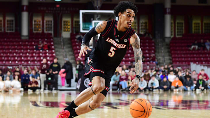 Feb 5, 2025; Chestnut Hill, Massachusetts, USA; Louisville Cardinals guard Terrence Edwards Jr. (5) controls the ball during the first half against the Boston College Eagles at Conte Forum. 