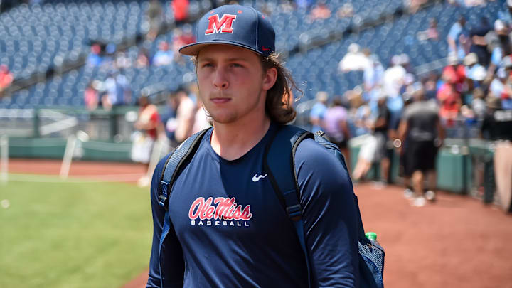 Jun 26, 2022; Omaha, NE, USA; Ole Miss Rebels starting pitcher Hunter Elliott (26) walks to the bullpen to warm up before the game against the Oklahoma Sooners at Charles Schwab Field. Mandatory Credit: Steven Branscombe-Imagn Images