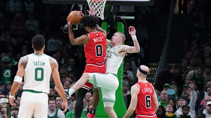 Jan 9, 2023; Boston, Massachusetts, USA; Chicago Bulls guard Coby White (0) defends against Boston
