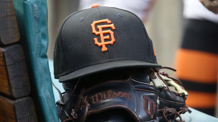 Jul 14, 2023; Pittsburgh, Pennsylvania, USA;  San Francisco Giants hat and glove on the bench against the Pittsburgh Pirates during the first inning at PNC Park. 