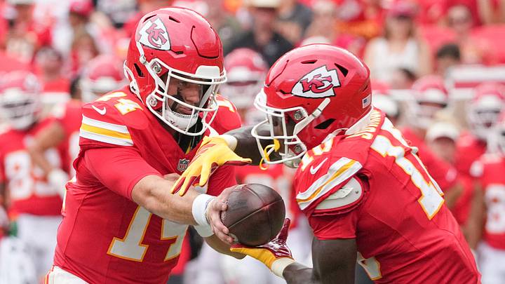Aug 15, 2026; Kansas City, Missouri, USA; Kansas City Chiefs quarterback Garrett Nussmeier (14) hands off to running back Emmett Johnson (10) against the Los Angeles Rams during the second half of the pre season game at Arrowhead Stadium. Mandatory Credit: Denny Medley-Imagn Images Aug 15, 2026; Kansas City, Missouri, USA; Kansas City Chiefs quarterback Garrett Nussmeier (14) hands off to running back Emmett Johnson (10) against the Los Angeles Rams during the second half of the pre season game at Arrowhead Stadium. Mandatory Credit: Denny Medley-Imagn Images