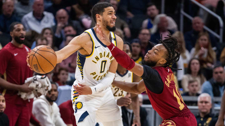 Mar 18, 2024; Indianapolis, Indiana, USA; Indiana Pacers guard Tyrese Haliburton (0) passes the ball while Cleveland Cavaliers guard Darius Garland (10) defends in the second half at Gainbridge Fieldhouse. Mandatory Credit: Trevor Ruszkowski-USA TODAY Sports