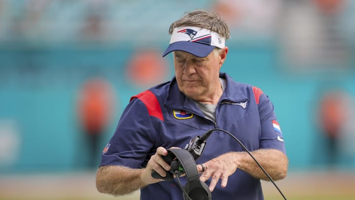 Oct 29, 2023; Miami Gardens, Florida, USA; New England Patriots head coach Bill Belichick tosses his headset against the Miami Dolphins during the fourth quarter at Hard Rock Stadium.