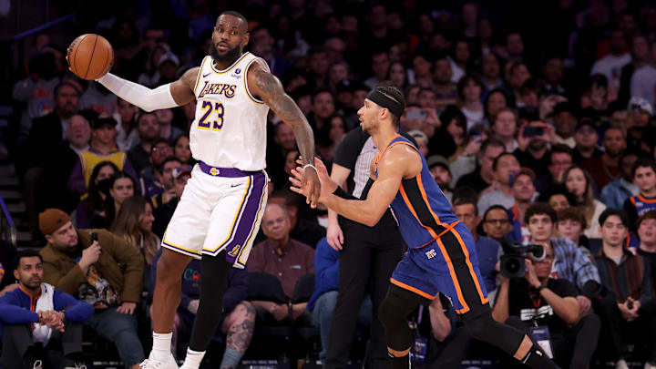 Feb 3, 2024; New York, New York, USA; Los Angeles Lakers forward LeBron James (23) controls the ball against New York Knicks guard Josh Hart (3) during the fourth quarter at Madison Square Garden. Mandatory Credit: Brad Penner-Imagn Images