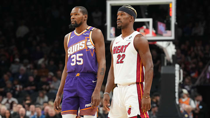 Nov 6, 2024; Phoenix, Arizona, USA; Phoenix Suns forward Kevin Durant (35) and Miami Heat forward Jimmy Butler (22) look on during the first half at Footprint Center. Mandatory Credit: Joe Camporeale-Imagn Images