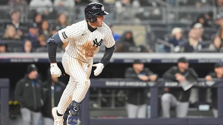 Apr 4, 2026; Bronx, New York, USA; New York Yankees third baseman Ryan McMahon (19) runs out a ground ball and is safe on a fielding error by the Miami Marlins during the third inning at Yankee Stadium. Mandatory Credit: Gregory Fisher-Imagn Images