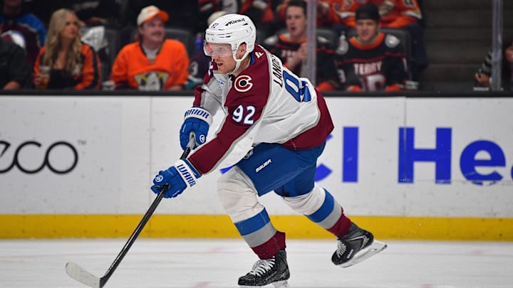 Mar 3, 2026; Anaheim, California, USA; Colorado Avalanche left wing Gabriel Landeskog (92) controls the puck against the Anaheim Ducks during the second period at Honda Center. Mandatory Credit: Gary A. Vasquez-Imagn Images