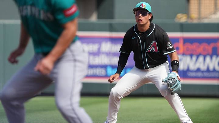 Arizona Diamondbacks infielder Demetrio Crisantes (5) tracks a pop-up against the Seattle Mariners at Salt River Fields on March 9, 2026. Arizona Diamondbacks infielder Demetrio Crisantes (5) tracks a pop-up against the Seattle Mariners at Salt River Fields on March 9, 2026.