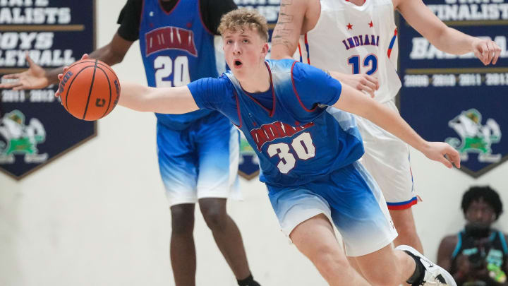 All-StarJack Benter (30) rushes up the court 