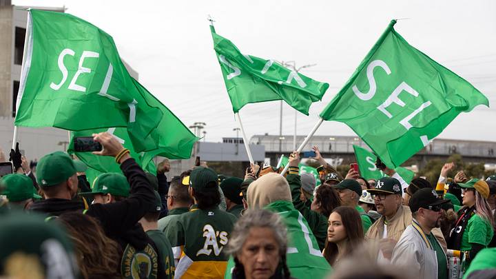 Mar 28, 2024; Oakland, California, USA; Oakland Athletics fans wave “Sell” flags to protest