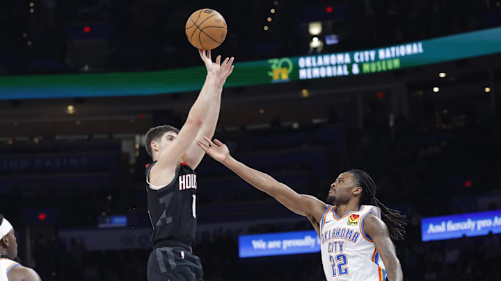 Mar 3, 2025; Oklahoma City, Oklahoma, USA; Houston Rockets guard Reed Sheppard (15) shoots a three point basket over Oklahoma City Thunder guard Cason Wallace (22) during the second half at Paycom Center. Mandatory Credit: Alonzo Adams-Imagn Images