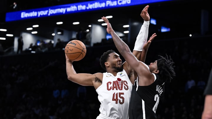 Feb 20, 2025; Brooklyn, New York, USA; Cleveland Cavaliers guard Donovan Mitchell (45) tries to dunk the ball as Brooklyn Nets center Day'Ron Sharpe (20) defends during the second half at Barclays Center. Mandatory Credit: John Jones-Imagn Images Feb 20, 2025; Brooklyn, New York, USA; Cleveland Cavaliers guard Donovan Mitchell (45) tries to dunk the ball as Brooklyn Nets center Day'Ron Sharpe (20) defends during the second half at Barclays Center. Mandatory Credit: John Jones-Imagn Images
