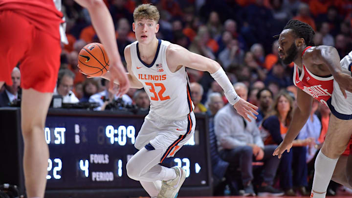 Feb 2, 2025; Champaign, Illinois, USA; Illinois Fighting Illini guard Kasparas Jakucionis (32) drives the ball during the first half against the Ohio State Buckeyes at State Farm Center. Mandatory Credit: Ron Johnson-Imagn Images