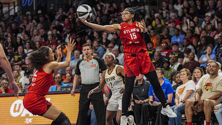 Jun 10, 2025; College Park, Georgia, USA; Atlanta Dream guard Allisha Gray (15) steals a pass against the Indiana Fever during the second half at Gateway Center Arena at College Park. Mandatory Credit: Dale Zanine-Imagn Images