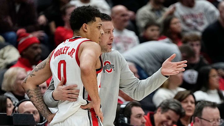 Ohio State Buckeyes head coach Jake Diebler talks to guard John Mobley Jr. (0) during the second half of the NCAA men's basketball game against the Valparaiso Beacons at Value City Arena in Columbus on Dec. 17, 2024. Ohio State won 95-73.
