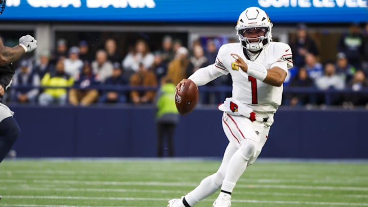 Nov 24, 2024; Seattle, Washington, USA; Arizona Cardinals quarterback Kyler Murray (1) rushes against the Seattle Seahawks during the fourth quarter at Lumen Field. Mandatory Credit: Joe Nicholson-Imagn Images