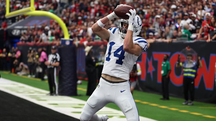 Jan 4, 2026; Houston, Texas, USA;  Indianapolis Colts wide receiver Alec Pierce (14) catches a touchdown pass against the Houston Texans during the first half at NRG Stadium. 