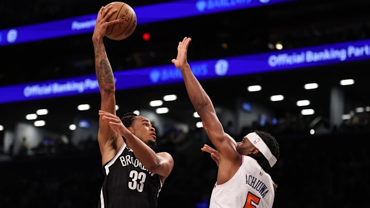 Apr 13, 2025; Brooklyn, New York, USA;  Brooklyn Nets center Nic Claxton (33) goes to the basket after the game New York Knicks forward Precious Achiuwa (5) during the second half at Barclays Center. Mandatory Credit: Vincent Carchietta-Imagn Images