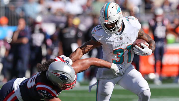 Oct 6, 2024; Foxborough, Massachusetts, USA; Miami Dolphins running back Raheem Mostert (31) runs the ball during the first half against the New England Patriots at Gillette Stadium.