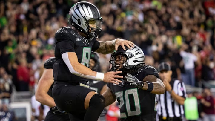 Oregon Ducks quarterback Dillon Gabriel and Oregon Ducks running back Jordan James celebrate a touchdown Oregon Ducks quarterback Dillon Gabriel and Oregon Ducks running back Jordan James celebrate a touchdown