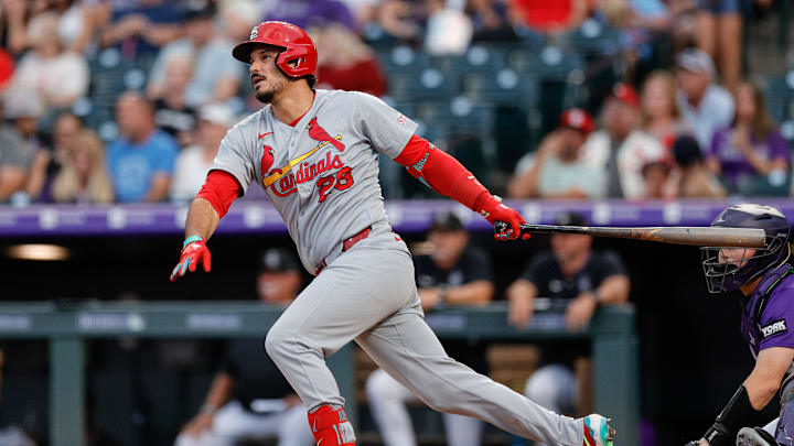 Jul 21, 2025; Denver, Colorado, USA; St. Louis Cardinals third baseman Nolan Arenado (28) hits a single in the sixth inning against the Colorado Rockies at Coors Field. Mandatory Credit: Isaiah J. Downing-Imagn Images
