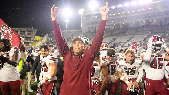 Nov 9, 2024; Nashville, Tennessee, USA;  South Carolina Gamecocks head coach Shane Beamer and his team celebrate the win with their fans against the Vanderbilt Commodores during the second half at FirstBank Stadium. Mandatory Credit: Steve Roberts-Imagn Images