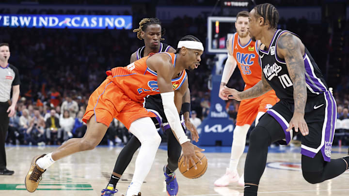 Feb 1, 2025; Oklahoma City, Oklahoma, USA; Oklahoma City Thunder guard Shai Gilgeous-Alexander (2) moves the ball down the court against Sacramento Kings forward DeMar DeRozan (10) during the second half at Paycom Center. Mandatory Credit: Alonzo Adams-Imagn Images Feb 1, 2025; Oklahoma City, Oklahoma, USA; Oklahoma City Thunder guard Shai Gilgeous-Alexander (2) moves the ball down the court against Sacramento Kings forward DeMar DeRozan (10) during the second half at Paycom Center. Mandatory Credit: Alonzo Adams-Imagn Images
