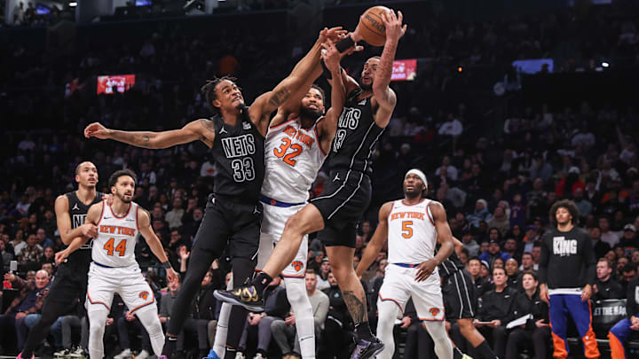 Jan 21, 2025; Brooklyn, New York, USA; Brooklyn Nets center Nic Claxton (33) and guard Tyrese Martin (13) fight with New York Knicks center Karl-Anthony Towns (32) for a rebound in the second quarter at Barclays Center. Mandatory Credit: Wendell Cruz-Imagn Images Jan 21, 2025; Brooklyn, New York, USA; Brooklyn Nets center Nic Claxton (33) and guard Tyrese Martin (13) fight with New York Knicks center Karl-Anthony Towns (32) for a rebound in the second quarter at Barclays Center. Mandatory Credit: Wendell Cruz-Imagn Images