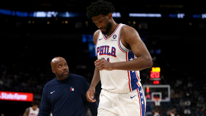 Nov 20, 2024; Memphis, Tennessee, USA; Philadelphia 76ers center Joel Embiid (21) limps to the bench during a time out during the second half against the Memphis Grizzlies at FedExForum. Mandatory Credit: Petre Thomas-Imagn Images