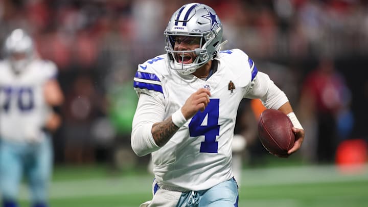 Dallas Cowboys QB Dak Prescott runs the ball against the Atlanta Falcons.
