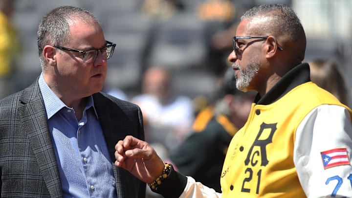 Apr 17, 2025; Pittsburgh, Pennsylvania, USA;  Pittsburgh Pirates president Travis Williams (left) and Roberto Clemente Jr. (right) son of former Pirates right fielder Roberto Clemente (not pictured) talk on the field before the game against the Washington Nationals at PNC Park. Mandatory Credit: Charles LeClaire-Imagn Images