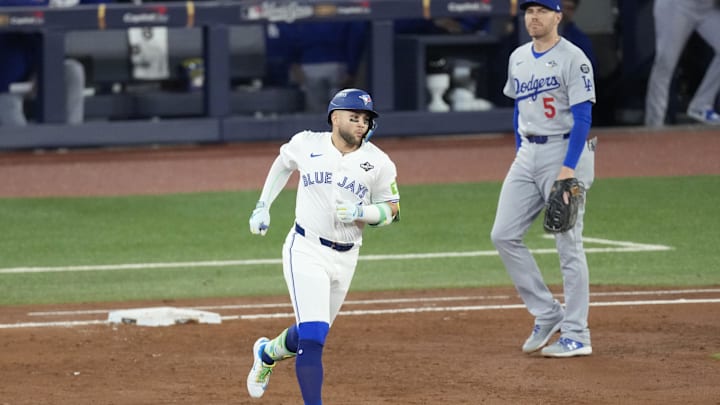 Nov 1, 2025; Toronto, Ontario, CAN; Toronto Blue Jays designated hitter Bo Bichette (11) runs the bases after hitting a three run home run against the Los Angeles Dodgers in the third inning during game seven of the 2025 MLB World Series at Rogers Centre. Mandatory Credit: Kevin Sousa-Imagn Images