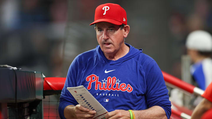Aug 21, 2024; Atlanta, Georgia, USA; Philadelphia Phillies manager Rob Thomson (59) in the dugout against the Atlanta Braves in the sixth inning at Truist Park.