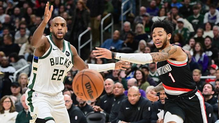 Jan 4, 2025; Milwaukee, Wisconsin, USA; Portland Trail Blazers guard Anfernee Simons (1) passes the ball away from Milwaukee Bucks forward Khris Middleton (22) in the second quarter at Fiserv Forum. Mandatory Credit: Benny Sieu-Imagn Images Jan 4, 2025; Milwaukee, Wisconsin, USA; Portland Trail Blazers guard Anfernee Simons (1) passes the ball away from Milwaukee Bucks forward Khris Middleton (22) in the second quarter at Fiserv Forum. Mandatory Credit: Benny Sieu-Imagn Images