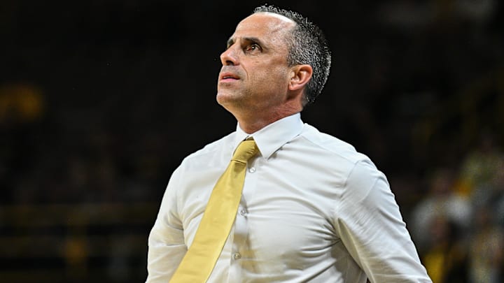 Iowa Hawkeyes head coach Ben McCollum