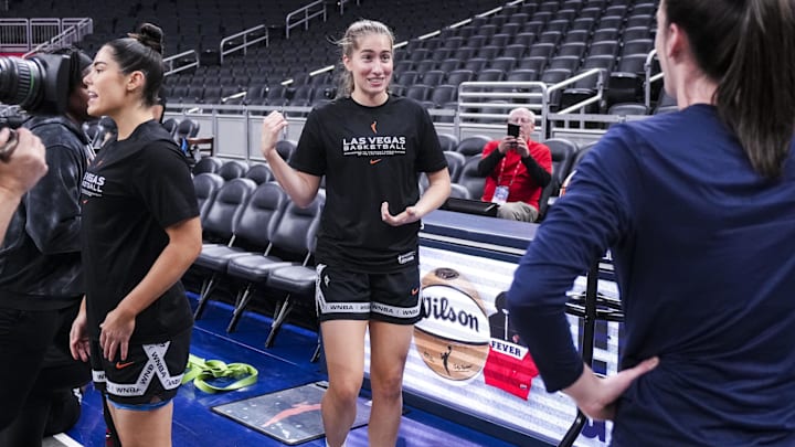 Sep 11, 2024; Indianapolis, IN, USA; Las Vegas Aces guard Kate Martin (20) and Indiana Fever guard Caitlin Clark (22), both former Iowa Hawkeyes, reunite Wednesday, Sept. 11, 2024, during a game between the Indiana Fever and the Las Vegas Aces at Gainbridge Fieldhouse in Indianapolis.  Mandatory Credit:  Grace Smith/USA TODAY NETWORK via Imagn Images