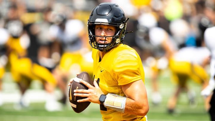 Aug 9, 2025; Iowa quarterback Mark Gronowski (11) runs a drill during the Hawkeyes Kids Day NCAA football open practice at Kinnick Stadium in Iowa City, Iowa. Mandatory Credit: Joseph Cress for the Des Moines Register