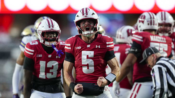 Nov 8, 2025; Madison, Wisconsin, USA;  Wisconsin Badgers quarterback Carter Smith (5) celebrates following a play during the second quarter against the Washington Huskies at Camp Randall Stadium. Mandatory Credit: Jeff Hanisch-Imagn Images