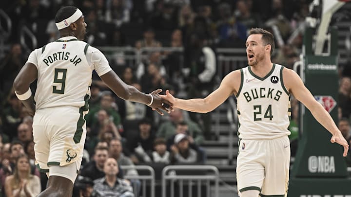 Apr 7, 2022; Milwaukee, Wisconsin, USA;  Milwaukee Bucks guard Pat Connaughton (24) and center Bobby Portis (9) reacts in the 2nd quarter during game against Boston Celtics at Fiserv Forum. Mandatory Credit: Benny Sieu-Imagn Images