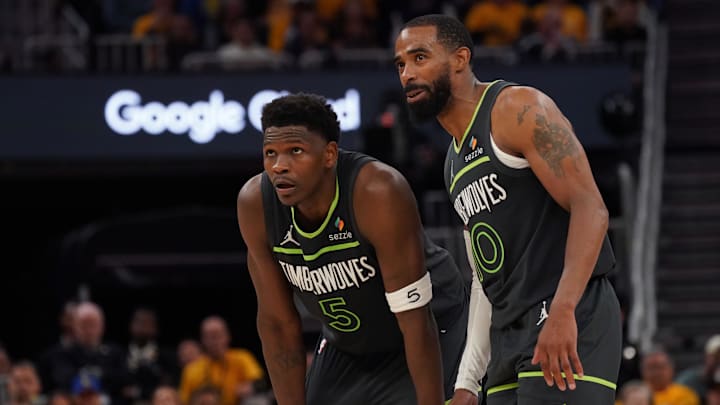 May 10, 2025; San Francisco, California, USA; Minnesota Timberwolves guard Anthony Edwards (5) and guard Mike Conley (10) wait for play to resume against the Golden State Warriors in the fourth quarter during game three in the second round for the 2025 NBA Playoffs at Chase Center.