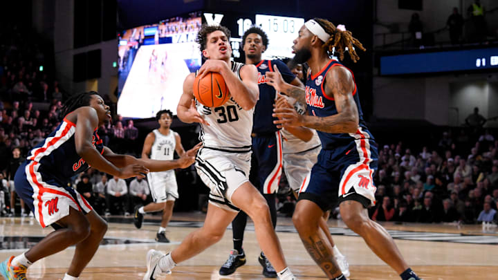 Feb 22, 2025; Nashville, Tennessee, USA; Vanderbilt Commodores guard Chris Manon (30) drives the lane against the Mississippi Rebels during the first half at Memorial Gymnasium. Mandatory Credit: Steve Roberts-Imagn Images