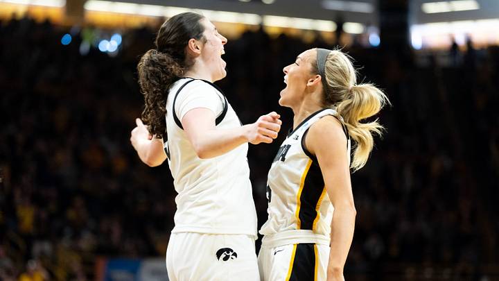 Iowa center Ava Heiden (5) and Iowa guard Kylie Feuerbach (4) react March 23, 2026 during a Round of 32 NCAA March Madness game against the Virginia Cavaliers at Carver-Hawkeye Arena in Iowa City, Iowa.