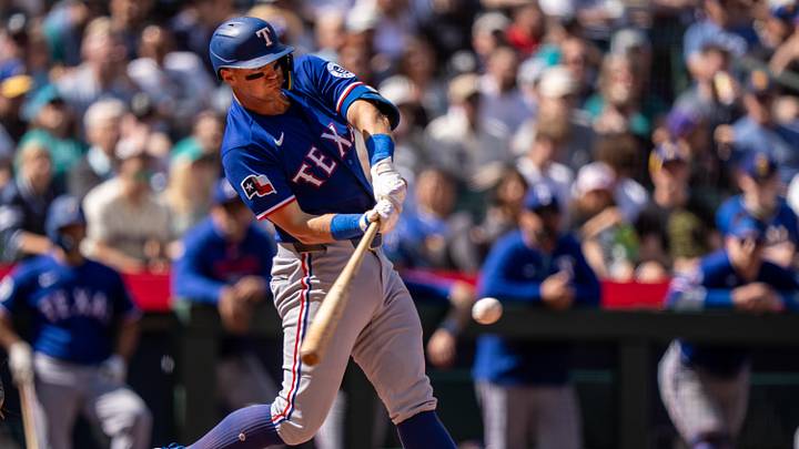 Texas Rangers third baseman Josh Jung (6) hits a RBI-sacrifice fly. 