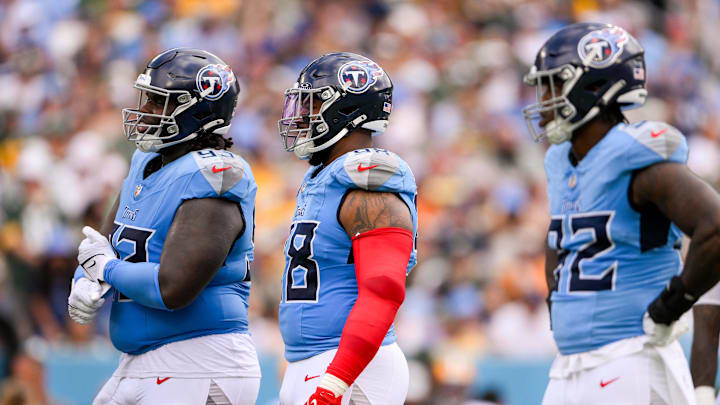 Sep 22, 2024; Nashville, Tennessee, USA;  Tennessee Titans defensive tackle T'Vondre Sweat (93), defensive tackle Jeffery Simmons (98), linebacker Jaylen Harrell (92) waits for the offense to come to the line against the Green Bay Packers during the first half at Nissan Stadium. Mandatory Credit: Steve Roberts-Imagn Images