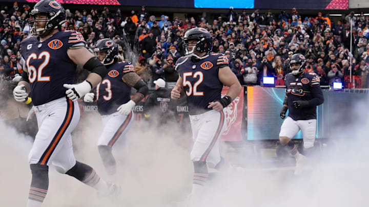 Jan 4, 2026; Chicago, Illinois, USA; Chicago Bears guard Joe Thuney (62) and center Drew Dalman (52) run onto the field before the game between the Chicago Bears and the Detroit Lions at Soldier Field. Mandatory Credit: David Banks-Imagn Images
