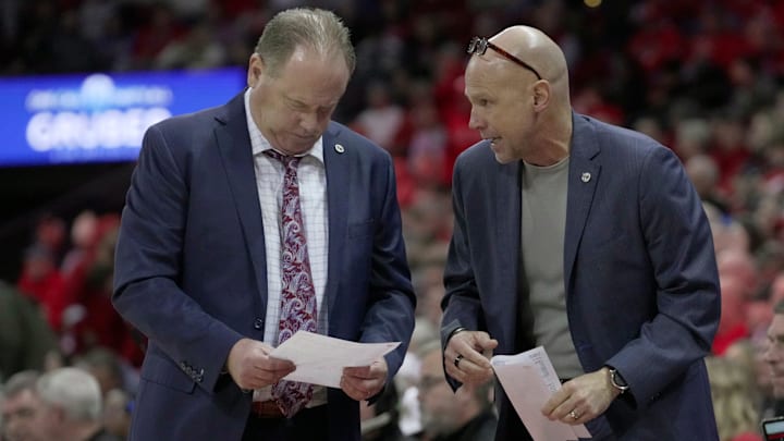 Wisconsin head coach Greg Gard, left, speaks with assistant coach :Lance Randall during the second half of their game Tuesday, January 6, 2026 at the Kohl Center in Madison, Wisconsin. Wisconsin beat UCLA 80-72.